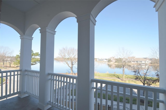 balcony featuring a water view