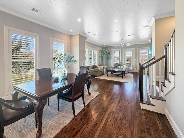 dining room featuring dark wood finished floors, baseboards, crown molding, and recessed lighting