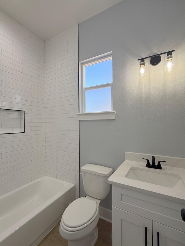 16366 Eastchase St, Montgomery, TX 77316 - full bath featuring shower / bath combination, wood finished floors, vanity, and toilet