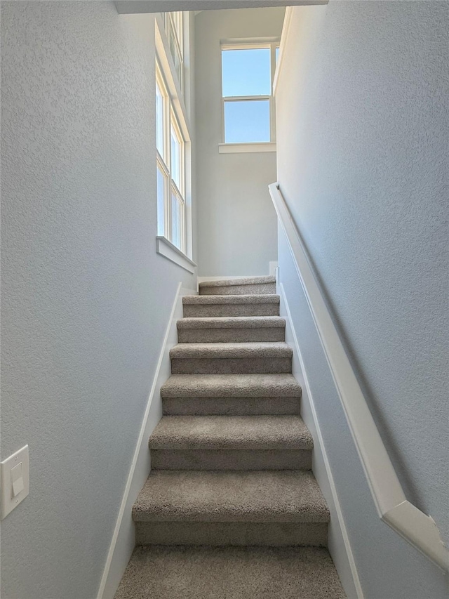 16366 Eastchase St, Montgomery, TX 77316 - stairway featuring a textured wall and baseboards