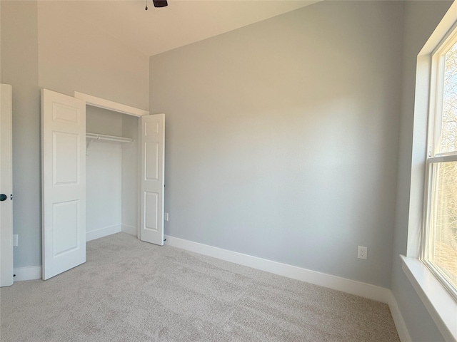16366 Eastchase St, Montgomery, TX 77316 - unfurnished bedroom with baseboards, a closet, and carpet