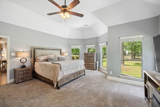 bedroom with a ceiling fan, high vaulted ceiling, carpet floors, and baseboards