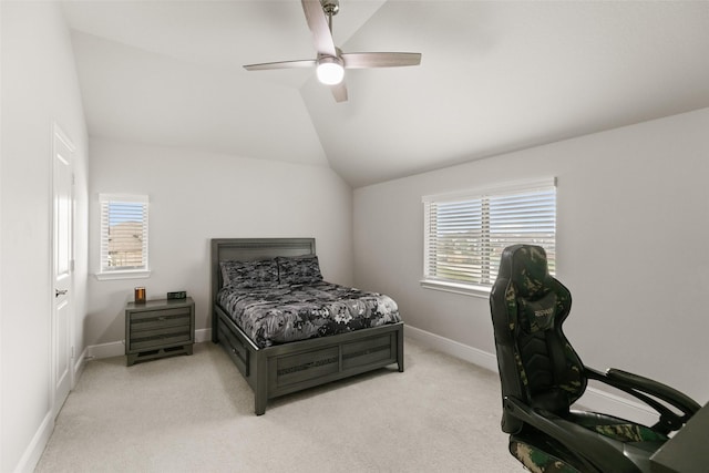 bedroom featuring baseboards, light colored carpet, ceiling fan, and vaulted ceiling