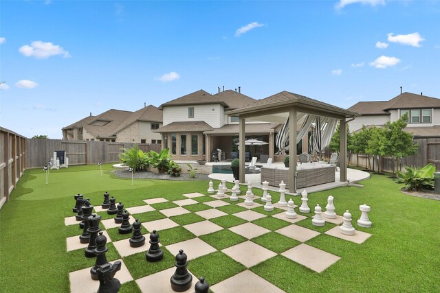 rear view of property with outdoor lounge area, a fenced backyard, french doors, a patio, and a yard