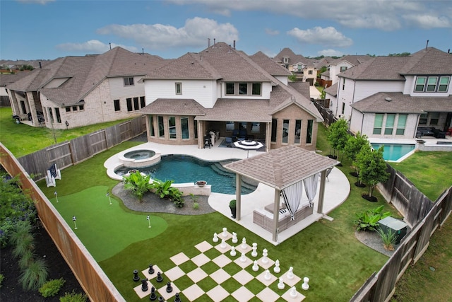 view of swimming pool with a yard, a gazebo, a residential view, and a patio area