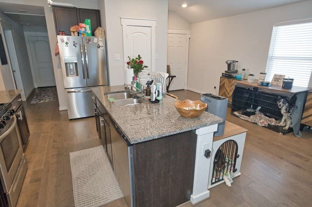 219 Lisa Marie Dr, Angleton, TX 77515 - kitchen with dark wood finished floors, light stone counters, stainless steel appliances, and a sink