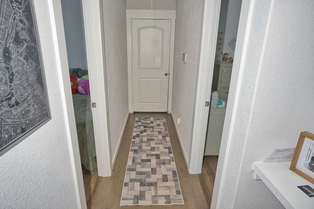 219 Lisa Marie Dr, Angleton, TX 77515 - hall with a textured wall and wood finished floors