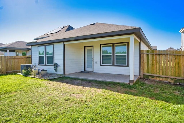 219 Lisa Marie Dr, Angleton, TX 77515 - rear view of property featuring a fenced backyard, a patio area, and a lawn