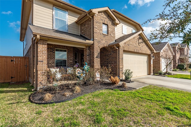 2214 Del Mar Dr, Texas City, TX 77568 - traditional-style home featuring brick siding, a front yard, concrete driveway, and fence