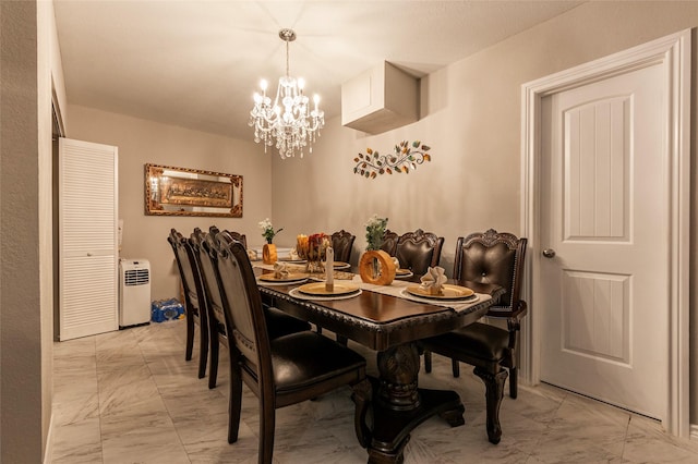 2214 Del Mar Dr, Texas City, TX 77568 - dining space featuring marble finish floor and an inviting chandelier
