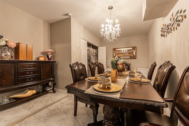 2214 Del Mar Dr, Texas City, TX 77568 - dining room with marble finish floor, baseboards, and a chandelier