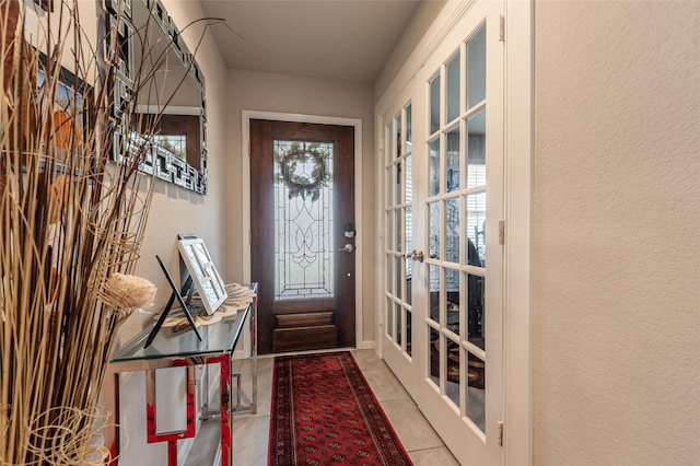 2214 Del Mar Dr, Texas City, TX 77568 - doorway with a textured wall and tile patterned floors