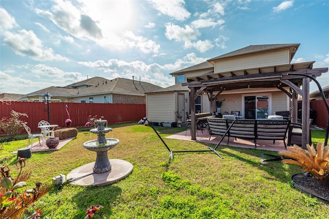2214 Del Mar Dr, Texas City, TX 77568 - back of house with a fenced backyard, a pergola, a patio area, an outdoor hangout area, and a yard