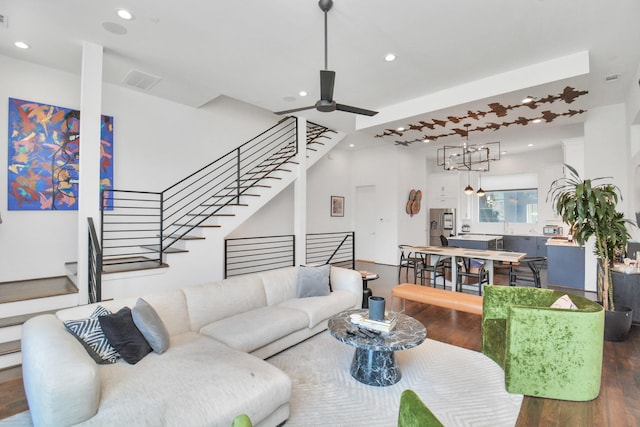 1512 Malone St, Houston, TX 77007 - living room featuring recessed lighting, wood finished floors, stairs, ceiling fan with notable chandelier, and visible vents