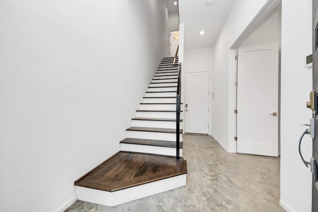 1512 Malone St, Houston, TX 77007 - stairway featuring baseboards, recessed lighting, and concrete flooring