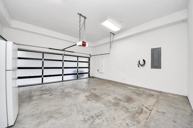 1512 Malone St, Houston, TX 77007 - garage with a garage door opener, electric panel, and freestanding refrigerator