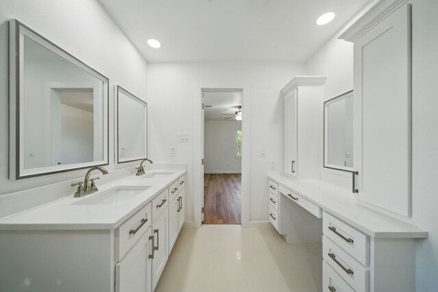 9711 Derrik Dr, Houston, TX 77080 - bathroom with ceiling fan, baseboards, a sink, and double vanity