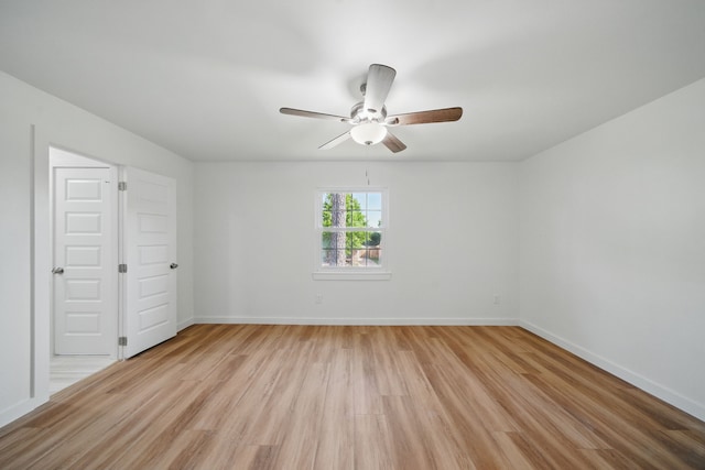 9711 Derrik Dr, Houston, TX 77080 - unfurnished bedroom featuring light wood-style floors, a ceiling fan, and baseboards