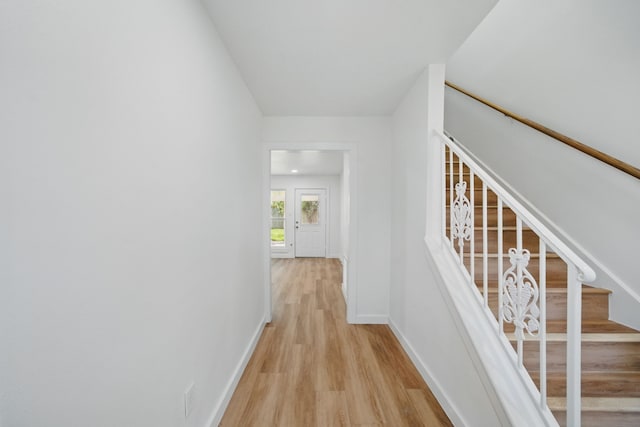 9711 Derrik Dr, Houston, TX 77080 - corridor with stairway, baseboards, and light wood finished floors