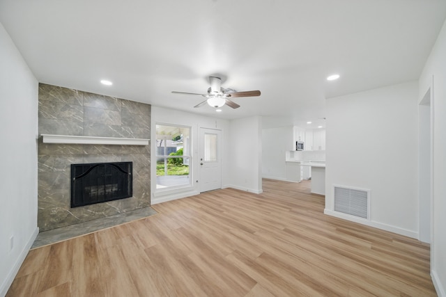 9711 Derrik Dr, Houston, TX 77080 - unfurnished living room featuring a tiled fireplace, visible vents, baseboards, and ceiling fan