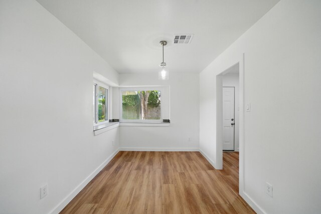 9711 Derrik Dr, Houston, TX 77080 - empty room featuring baseboards, visible vents, and light wood-style floors