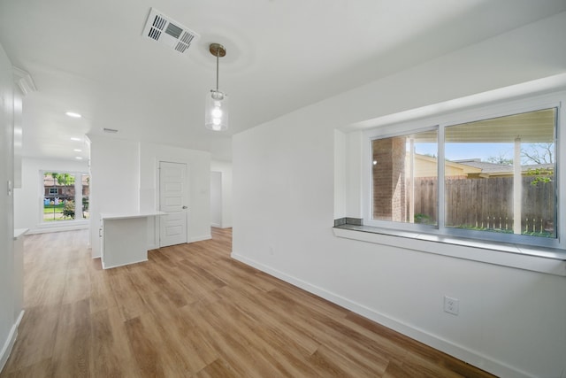 9711 Derrik Dr, Houston, TX 77080 - unfurnished dining area featuring recessed lighting, baseboards, visible vents, and light wood-type flooring