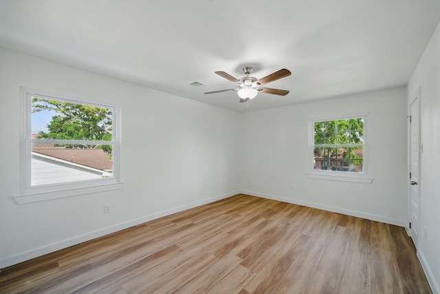 9711 Derrik Dr, Houston, TX 77080 - unfurnished room featuring visible vents, a ceiling fan, baseboards, and light wood-style floors