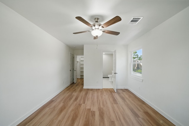9711 Derrik Dr, Houston, TX 77080 - unfurnished bedroom with a ceiling fan, a spacious closet, light wood finished floors, baseboards, and visible vents