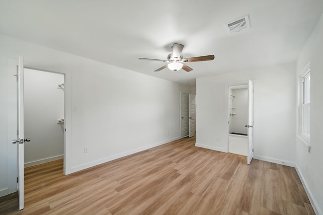 9711 Derrik Dr, Houston, TX 77080 - unfurnished bedroom with visible vents, a spacious closet, and light wood-style floors