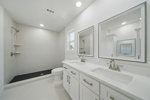 9711 Derrik Dr, Houston, TX 77080 - bathroom featuring tiled shower, visible vents, a sink, and toilet