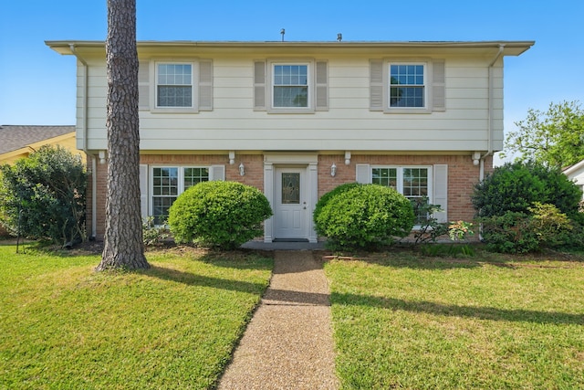 9711 Derrik Dr, Houston, TX 77080 - colonial home featuring brick siding and a front yard