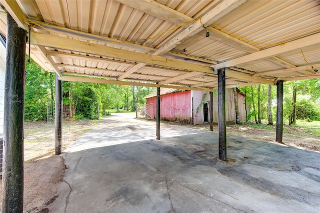 808 State Highway Loop 393, Goodrich, TX 77335 - view of patio / terrace with a carport and an outbuilding