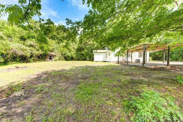 808 State Highway Loop 393, Goodrich, TX 77335 - view of yard with an outbuilding