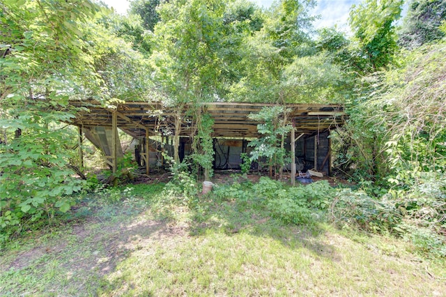 808 State Highway Loop 393, Goodrich, TX 77335 - rear view of house with an outbuilding