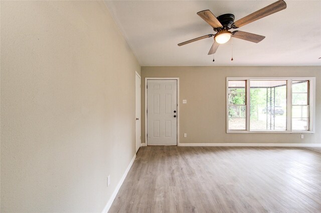808 State Highway Loop 393, Goodrich, TX 77335 - spare room with light wood-style floors, baseboards, and ceiling fan