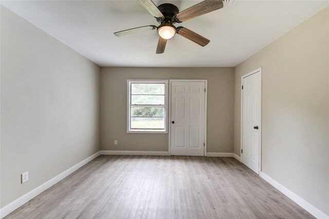 808 State Highway Loop 393, Goodrich, TX 77335 - unfurnished room with light wood-style flooring, baseboards, and ceiling fan