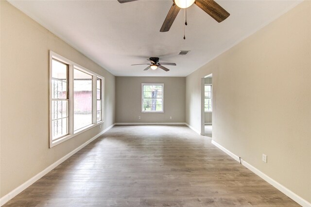 808 State Highway Loop 393, Goodrich, TX 77335 - empty room with ceiling fan, baseboards, and wood finished floors