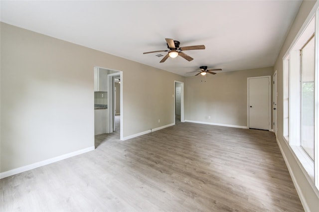 808 State Highway Loop 393, Goodrich, TX 77335 - spare room with ceiling fan, baseboards, and light wood-style floors