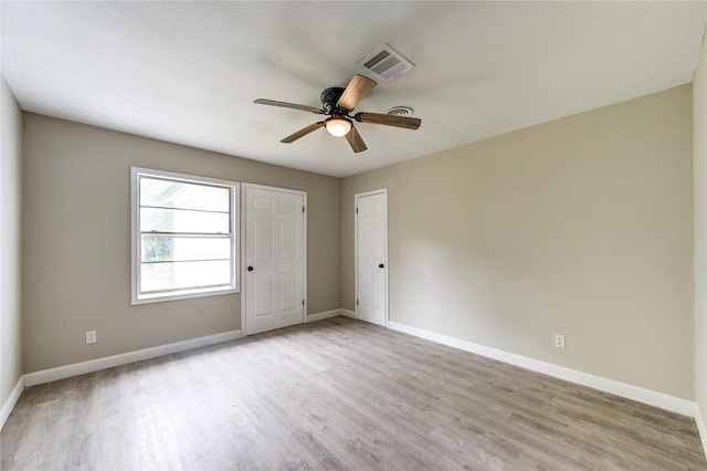 808 State Highway Loop 393, Goodrich, TX 77335 - unfurnished bedroom featuring light wood-type flooring, baseboards, and a ceiling fan