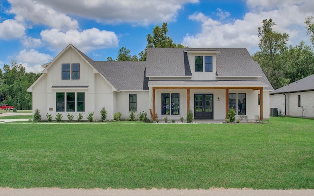 modern farmhouse featuring french doors, roof with shingles, a front lawn, and central AC unit