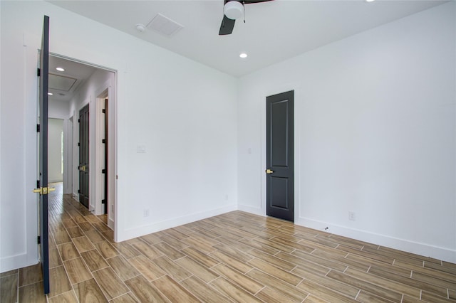 unfurnished room with light wood-style flooring, baseboards, and ceiling fan