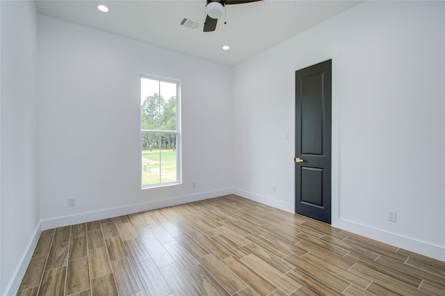 empty room with visible vents, baseboards, recessed lighting, ceiling fan, and wood finish floors