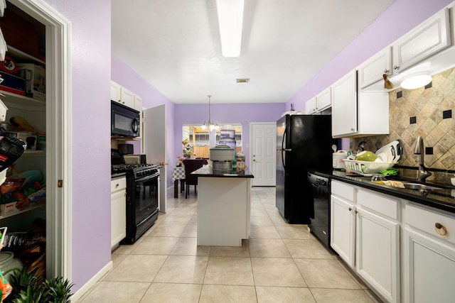 kitchen featuring dark countertops, tasteful backsplash, a kitchen island, and black appliances