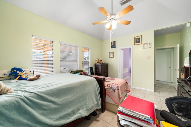 bedroom featuring vaulted ceiling, visible vents, a ceiling fan, light tile patterned floors, and baseboards