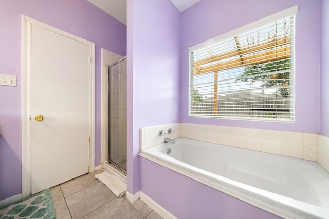 full bathroom featuring a garden tub, tile patterned flooring, and a stall shower