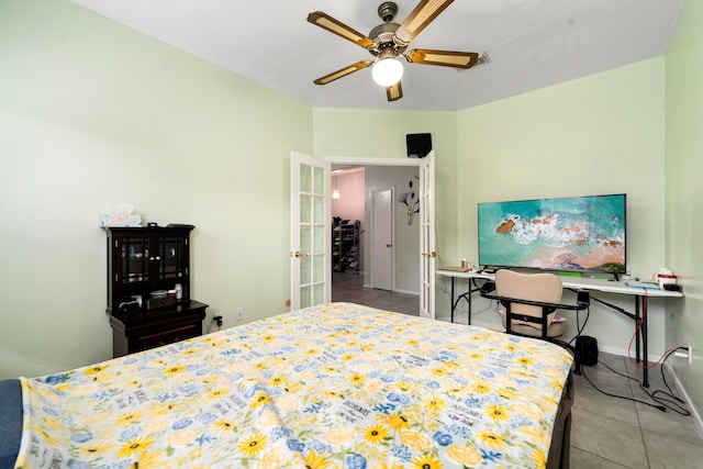 bedroom with tile patterned flooring, baseboards, a ceiling fan, and french doors