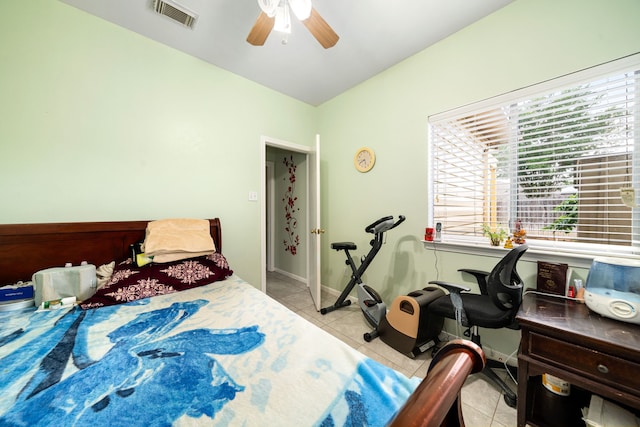 bedroom with ceiling fan, baseboards, visible vents, and light tile patterned floors