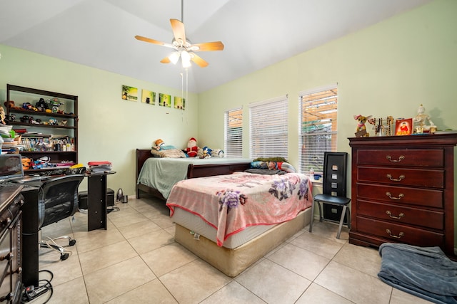 bedroom featuring lofted ceiling, a ceiling fan, and light tile patterned floors