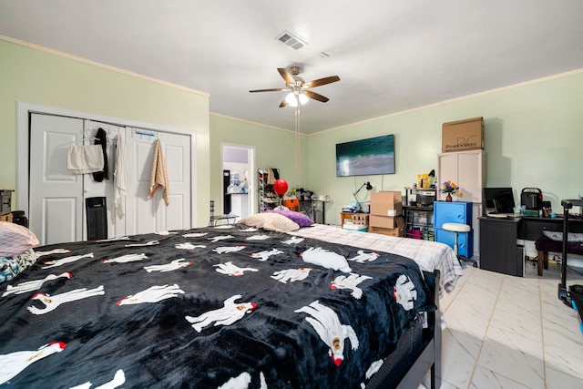bedroom featuring a closet, marble finish floor, a ceiling fan, and ornamental molding