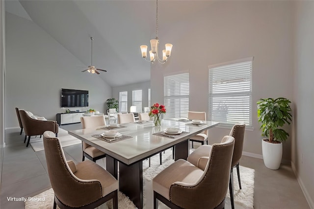 6907 Arcadia Meadow Ct, Richmond, TX 77407 - dining area with high vaulted ceiling, ceiling fan, a chandelier, baseboards, and light tile patterned floors